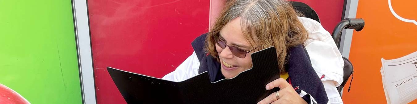 A staff member looking at a clipboard, marking things off!