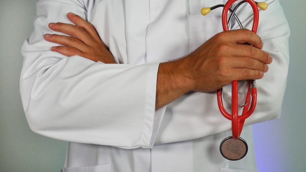 A doctor holding a stethoscope