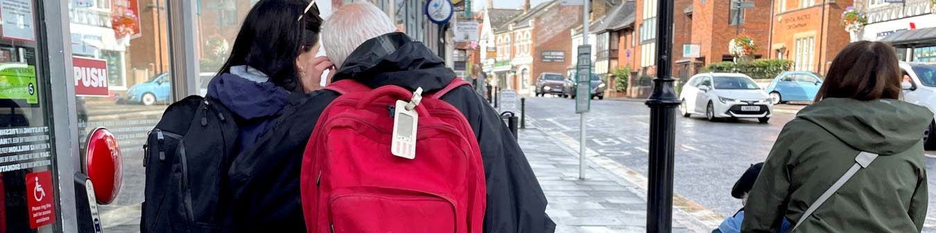 Staff and members walking down Dorking High Street