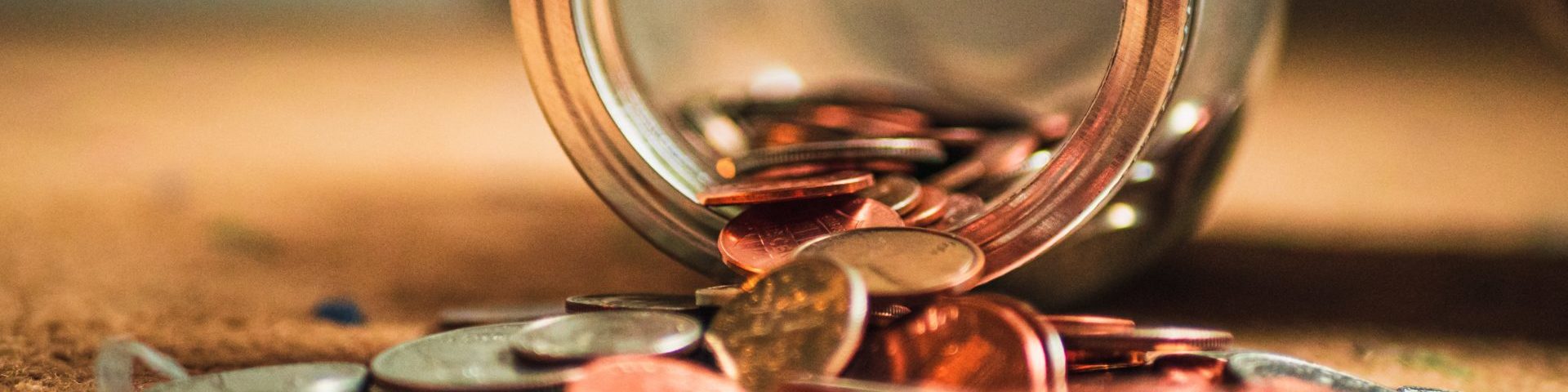 Coins pouring out of a jar