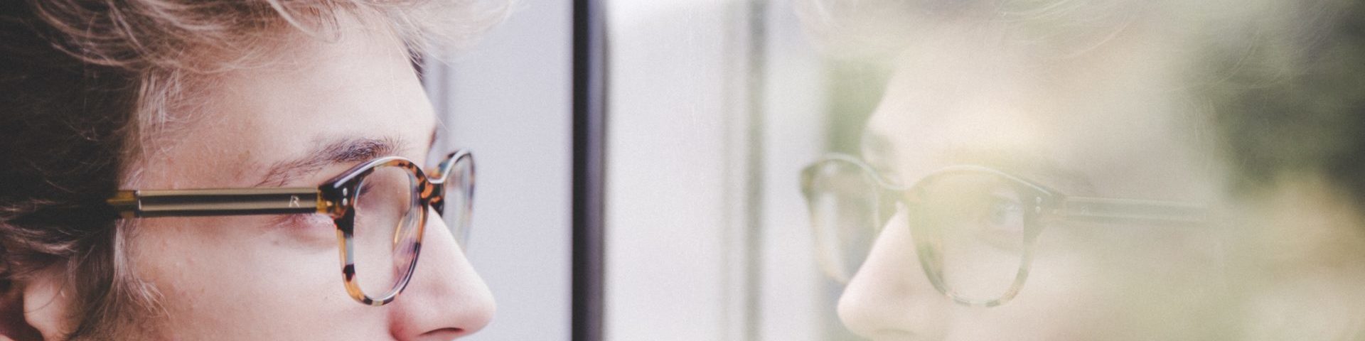 A man looking out of a window