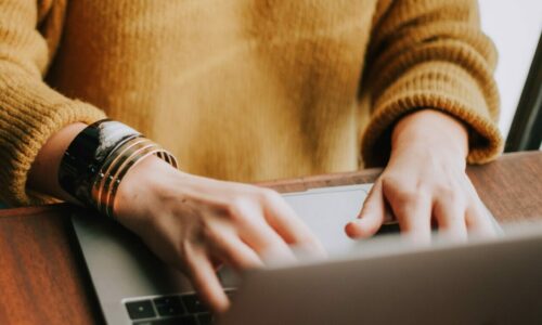 Person typing on a laptop