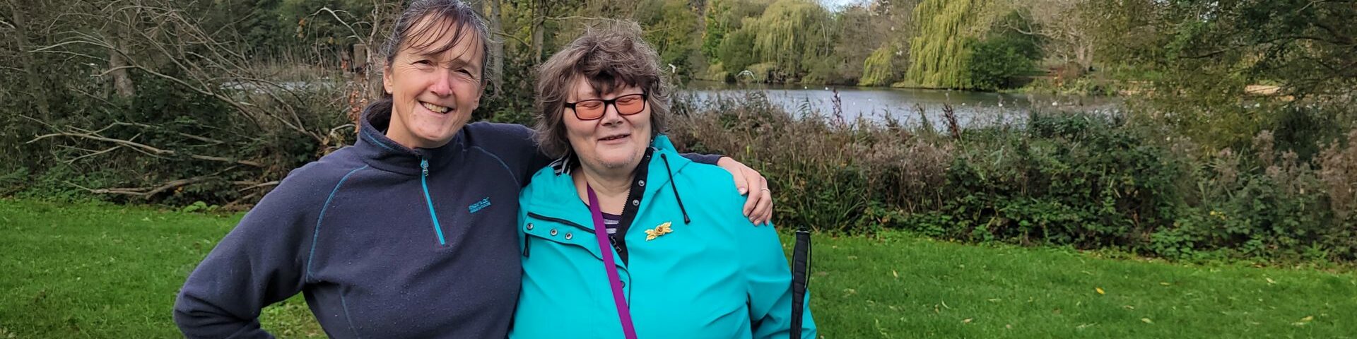 Coalition member Jane on a walk with staff member Caroline