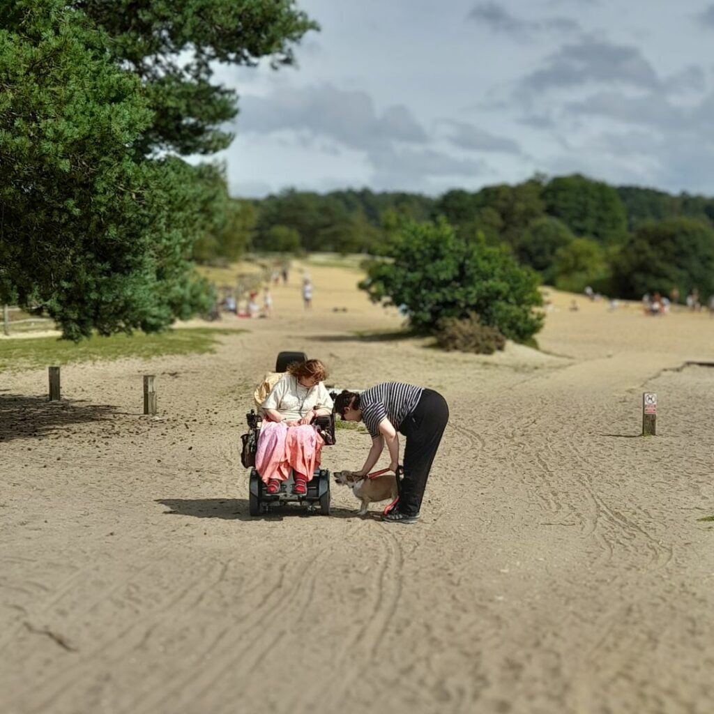 Coalition member Suzân and staff member Alex with her dog at Frensham Great Pond. 