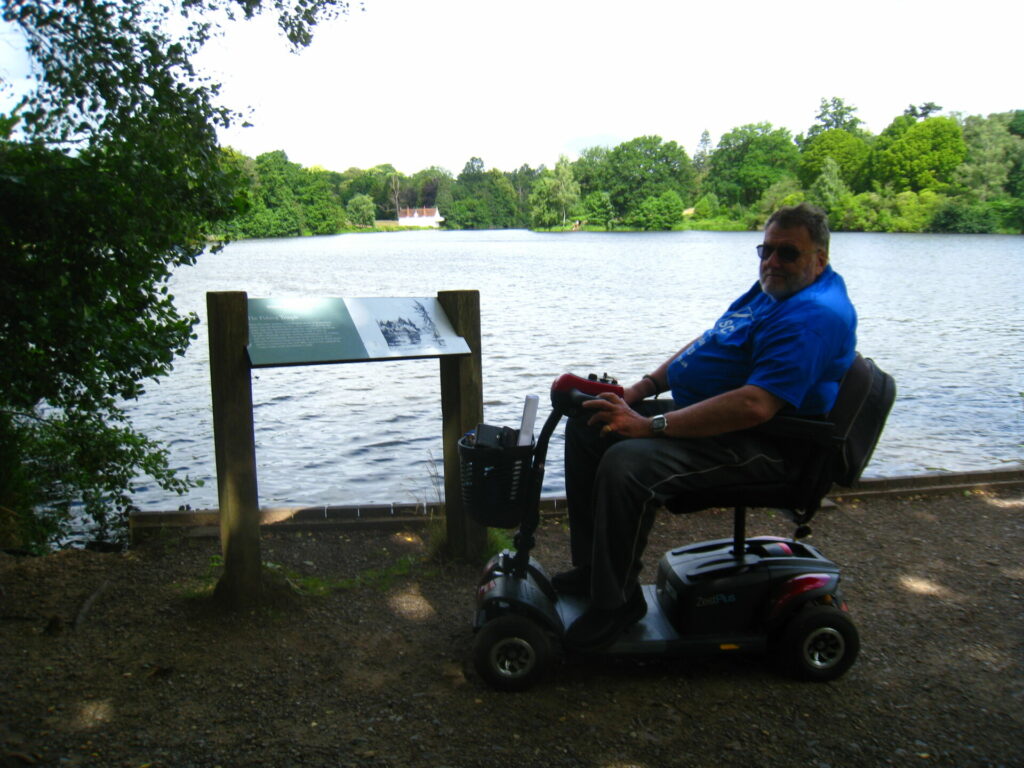 David at Virginia Water with a lake in the background 