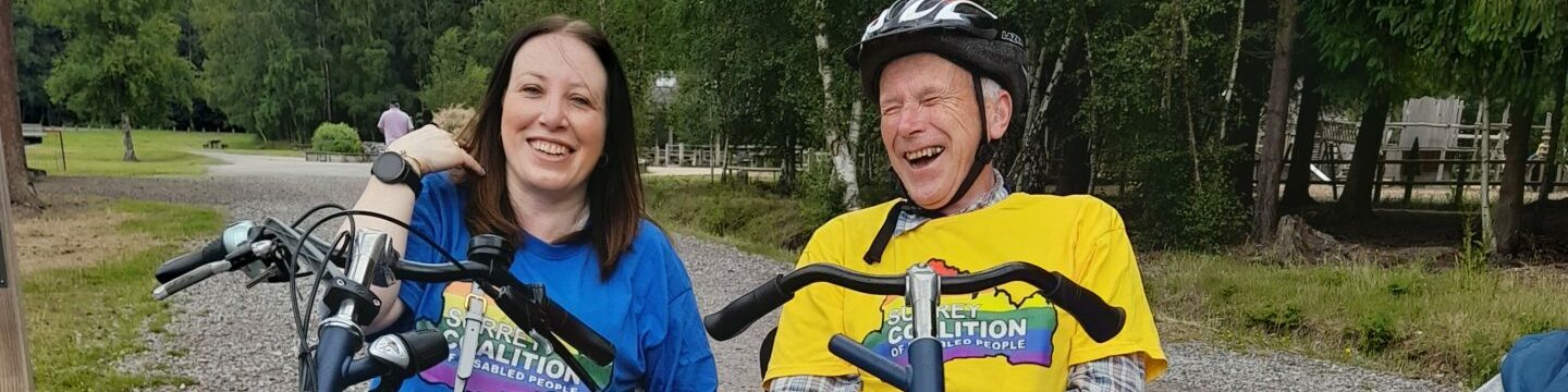 Yasmin, our Involvement Lead and Jonathan, Coalition member riding a tandem bike.