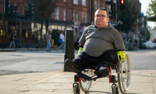 Man wheeling through a high street