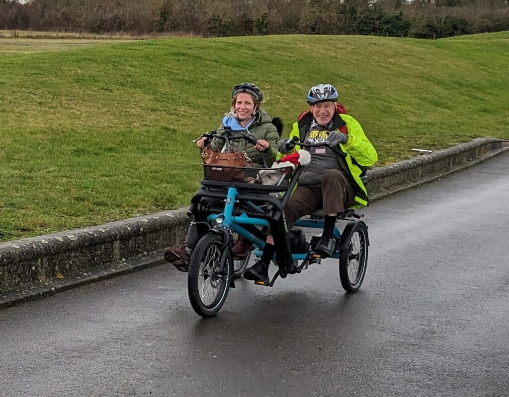 The Coalition's CEO Nikki and member Jonathan on a tandem bike at the Winter Wonderwheels event in 2023.