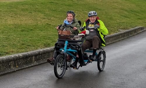 The Coalition's CEO Nikki and member Jonathan on a tandem bike at the Winter Wonderwheels event in 2023.