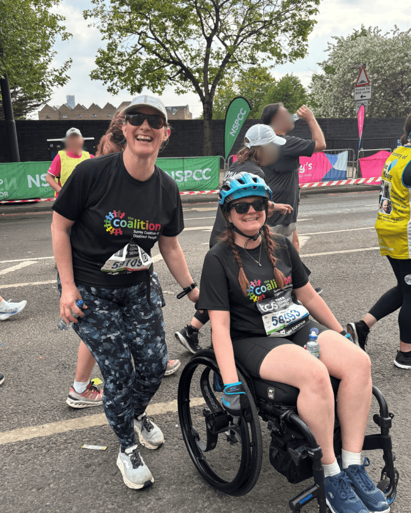 Coalition staff members Katy and Megan mid-marathon with big smiles! 