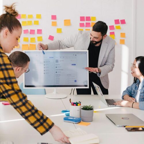 Team meeting with a digital board