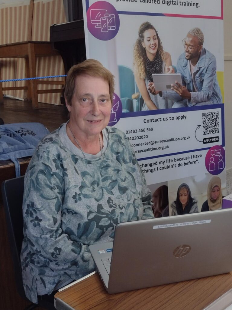 Tech Member Susette with a laptop