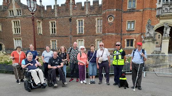 Coalition members and staff outside the Hampton Court Palace entrance. 