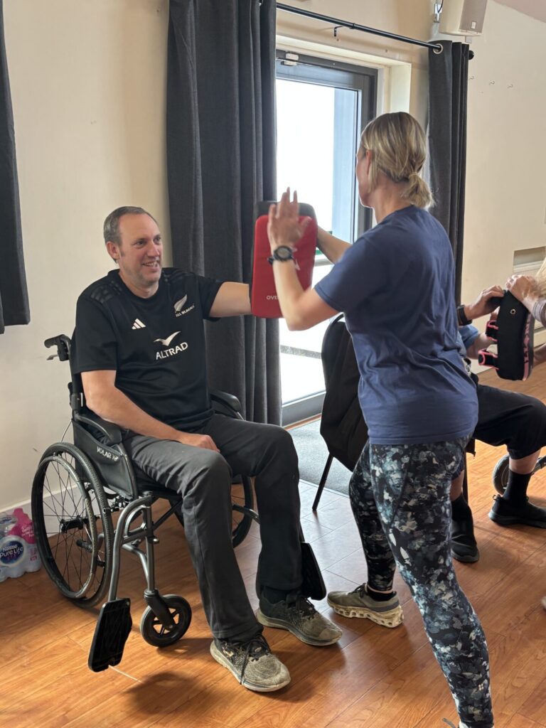 Coalition member Steve with staff member Katy participating in karate.