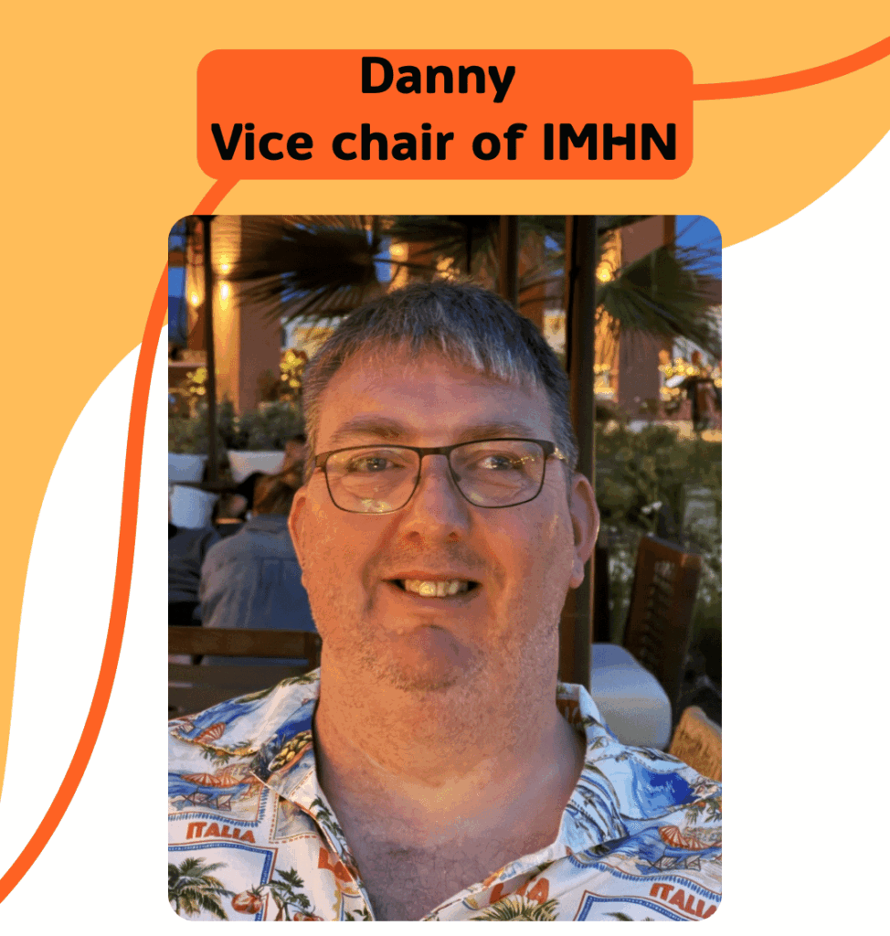 IMHN Vice Chair Danny, he is smiling and wearing glasses.