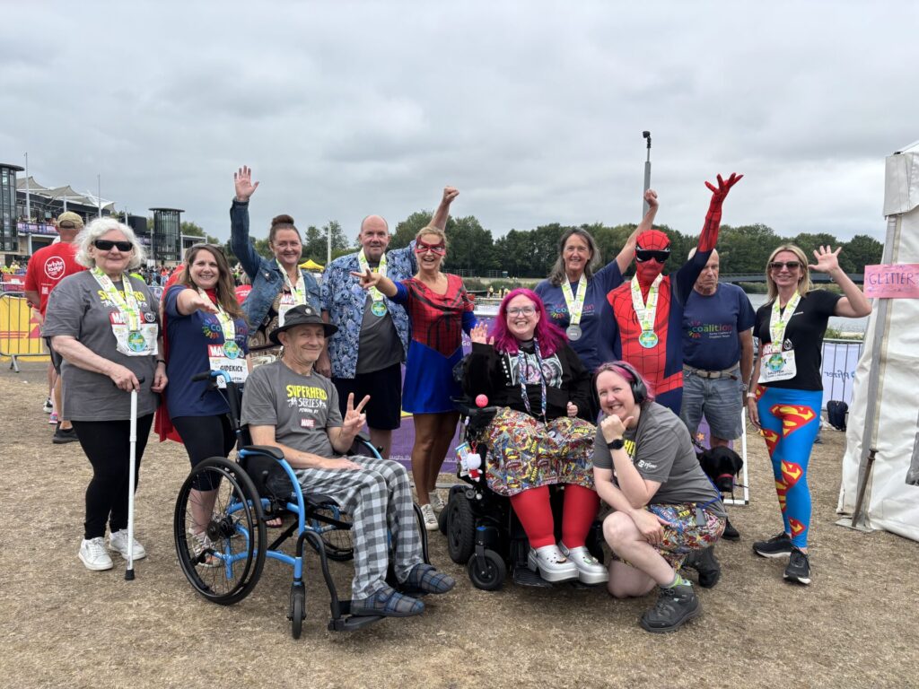 Group photo of Coalition members and staff at the Superhero Tri.