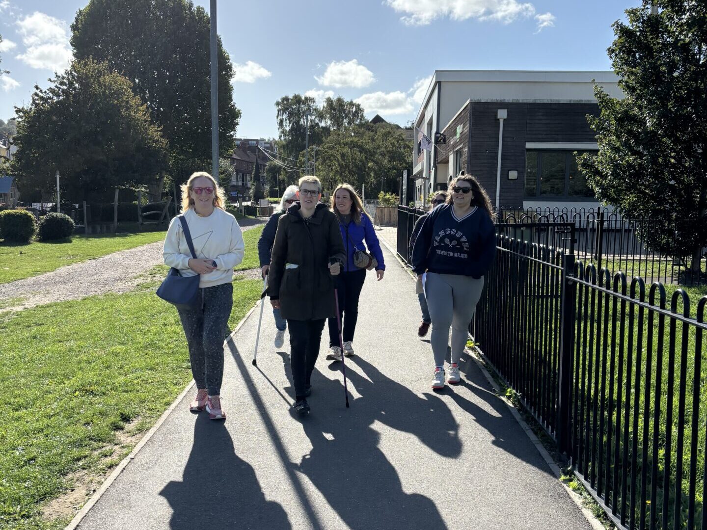 Coalition members and staff walking along a footpath in Dorking  at the walking festival. 