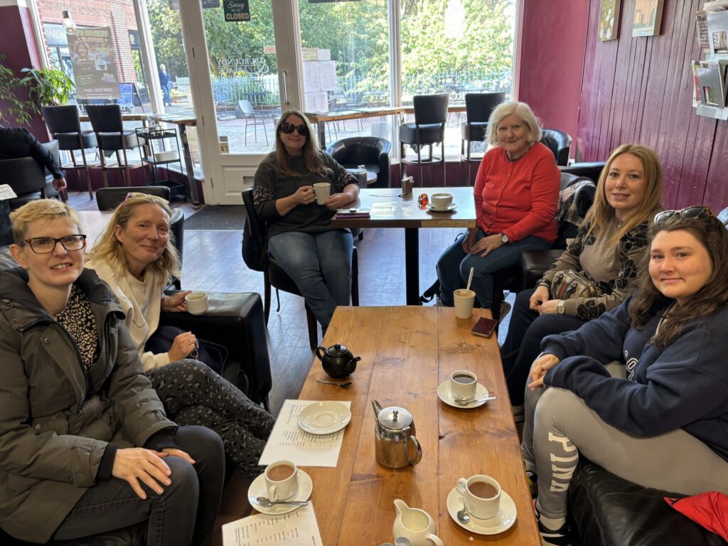 Coalition members and staff at a cafe. 