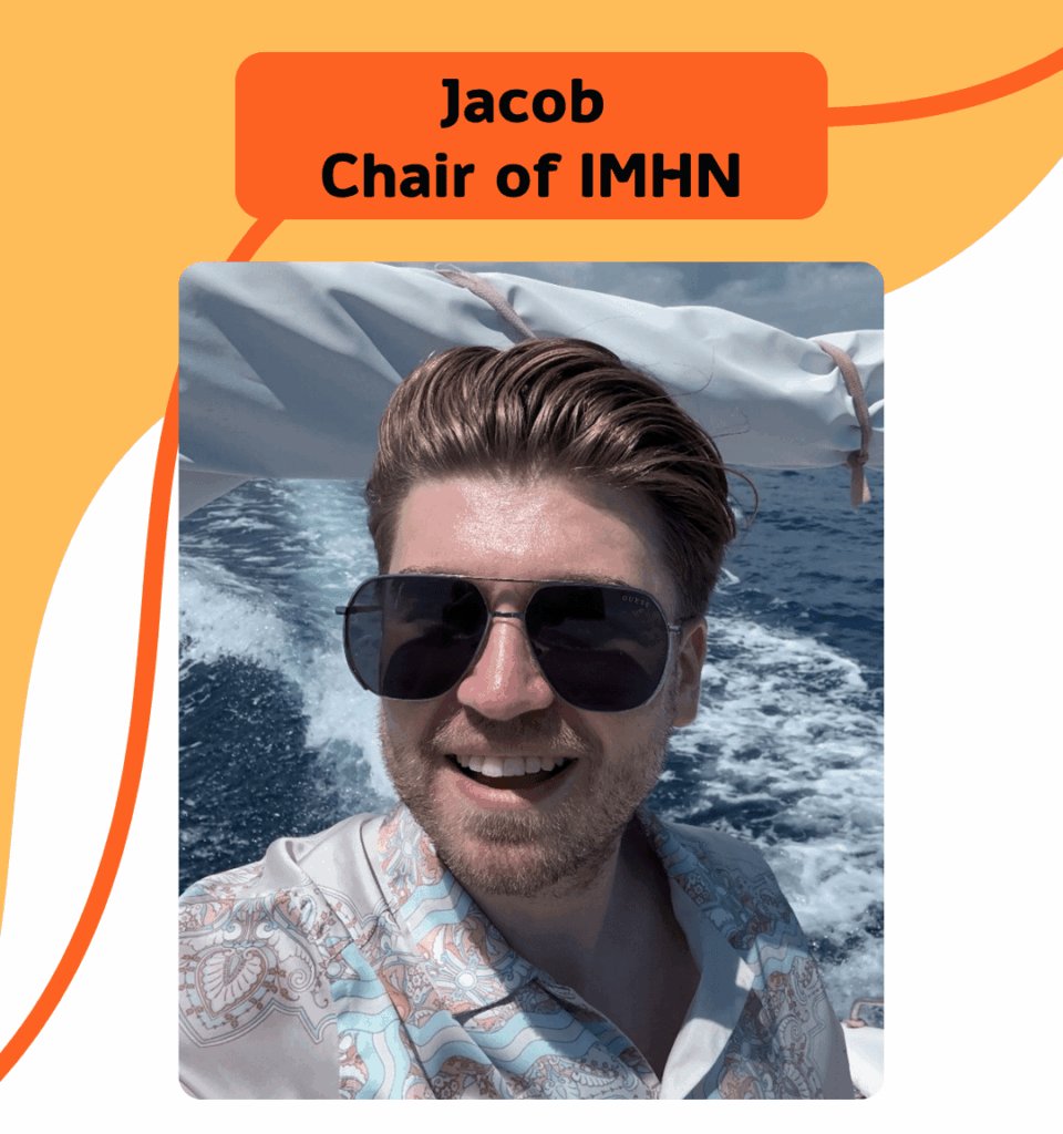 Jacob, the new IMHN Chair, he is smiling, wearing sunglasses and on a boat. 