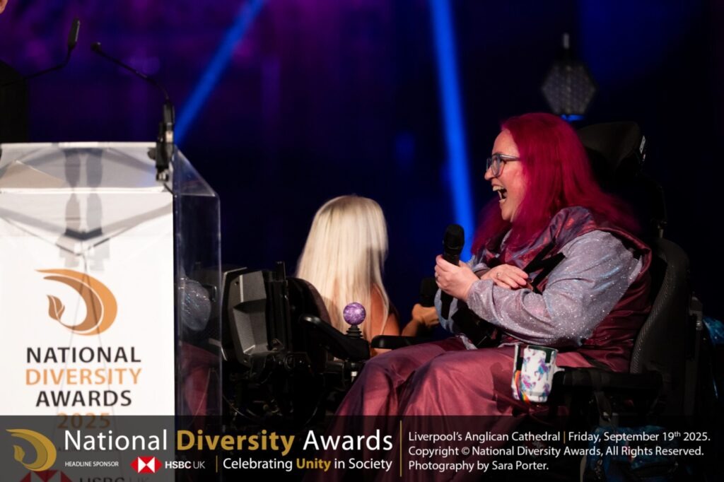 Vikki Walton-Cole, Chair of Trustees at5 The Coalition receiving the award with a huge smile at the National Diversity Awards.  