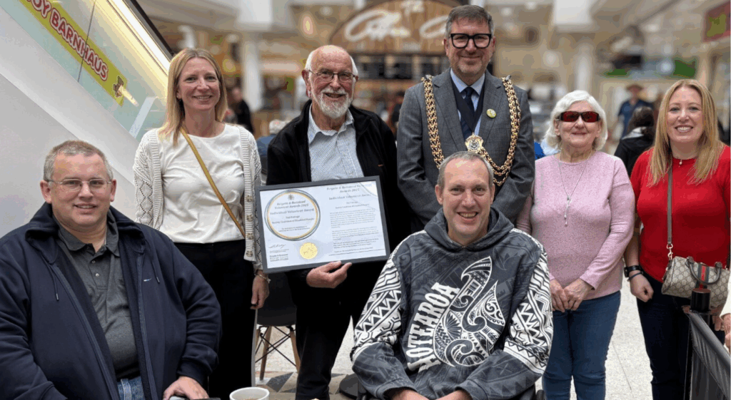The Mayor of Reigate & Banstead with Ted who is holding his Volunteers awards, and with Coalition members and staff. 