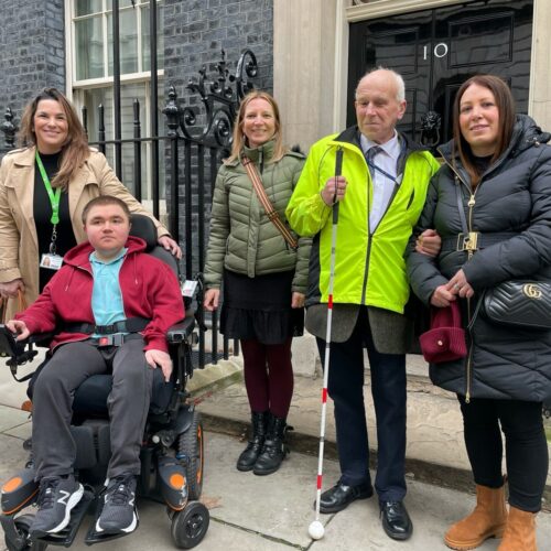 Coalition Members and staff outside the Number 10 Downing street door