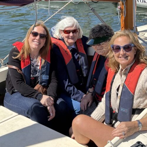 Coalition members and staff on a sailing boat.