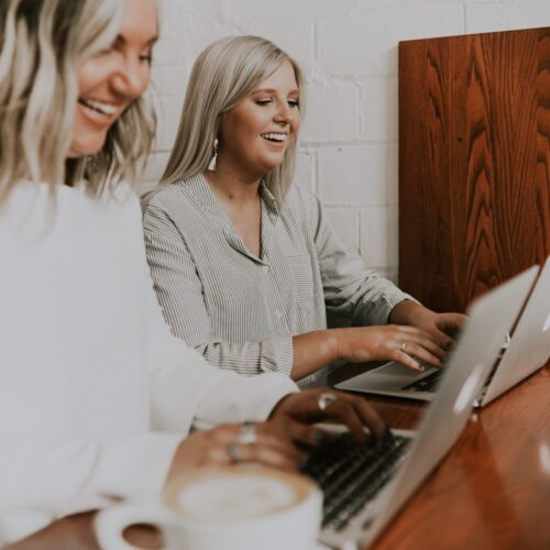 Two woman on laptops
