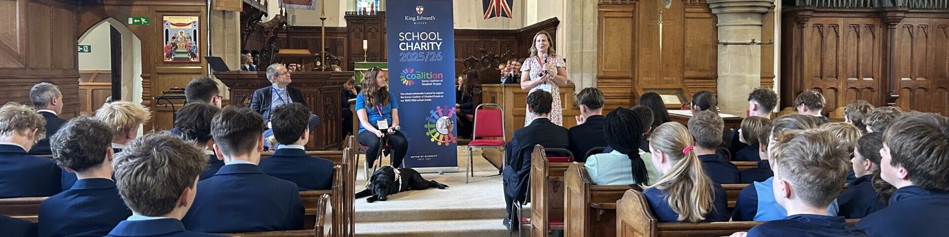 Coalition staff members, Rachel and Megan, with assistance dog Rowley at King Edwards school speaking to the pupils in a chapel.