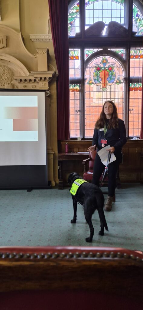 Megan presenting with her assistance dog Rowley. 